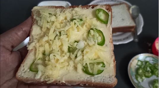 easy chilli cheese toast - grated cheese on top of bread